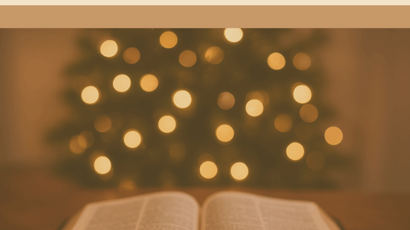 Open Bible with soft Christmas lights in the background, symbolizing Advent devotion and spiritual preparation for Christmas.